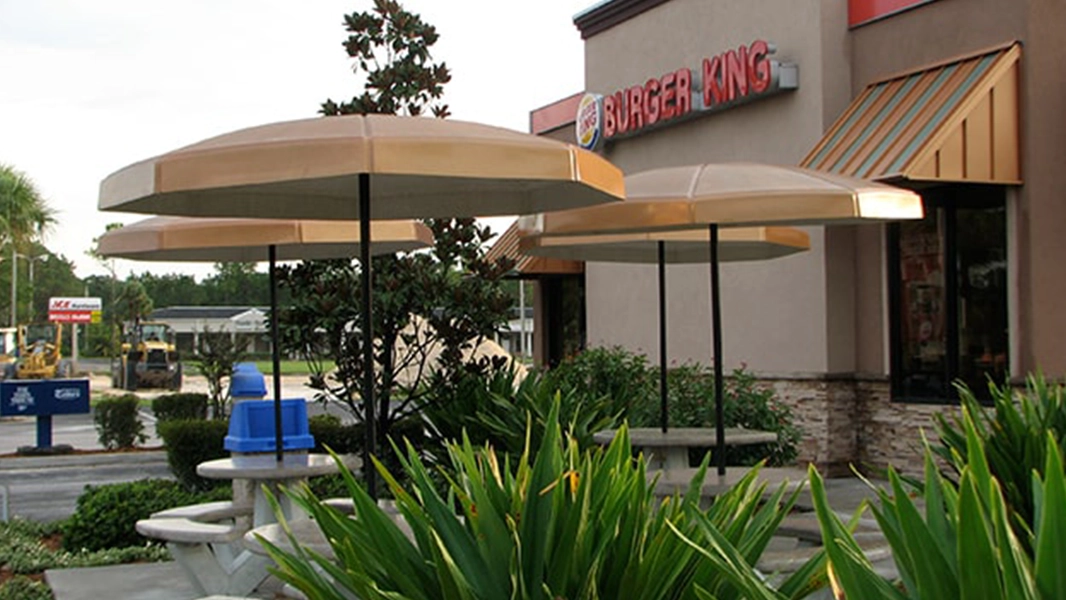 Commercial fiberglass hard-top canopy umbrellas over outdoor seating
